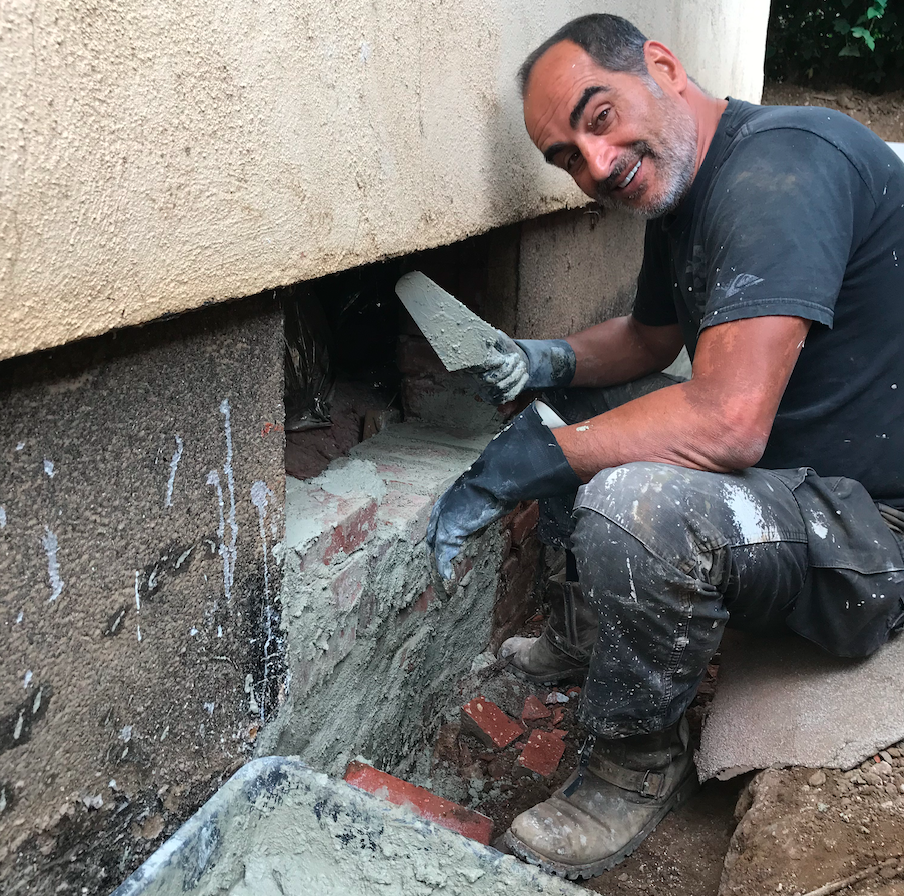Navid Negahban working in construction