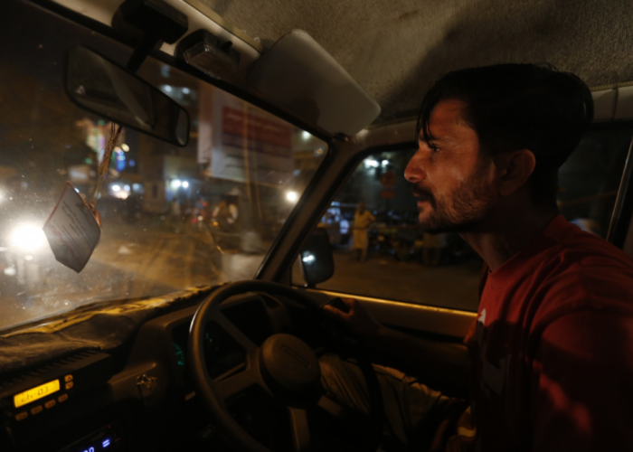 Safdar at the wheel of his ambulance.